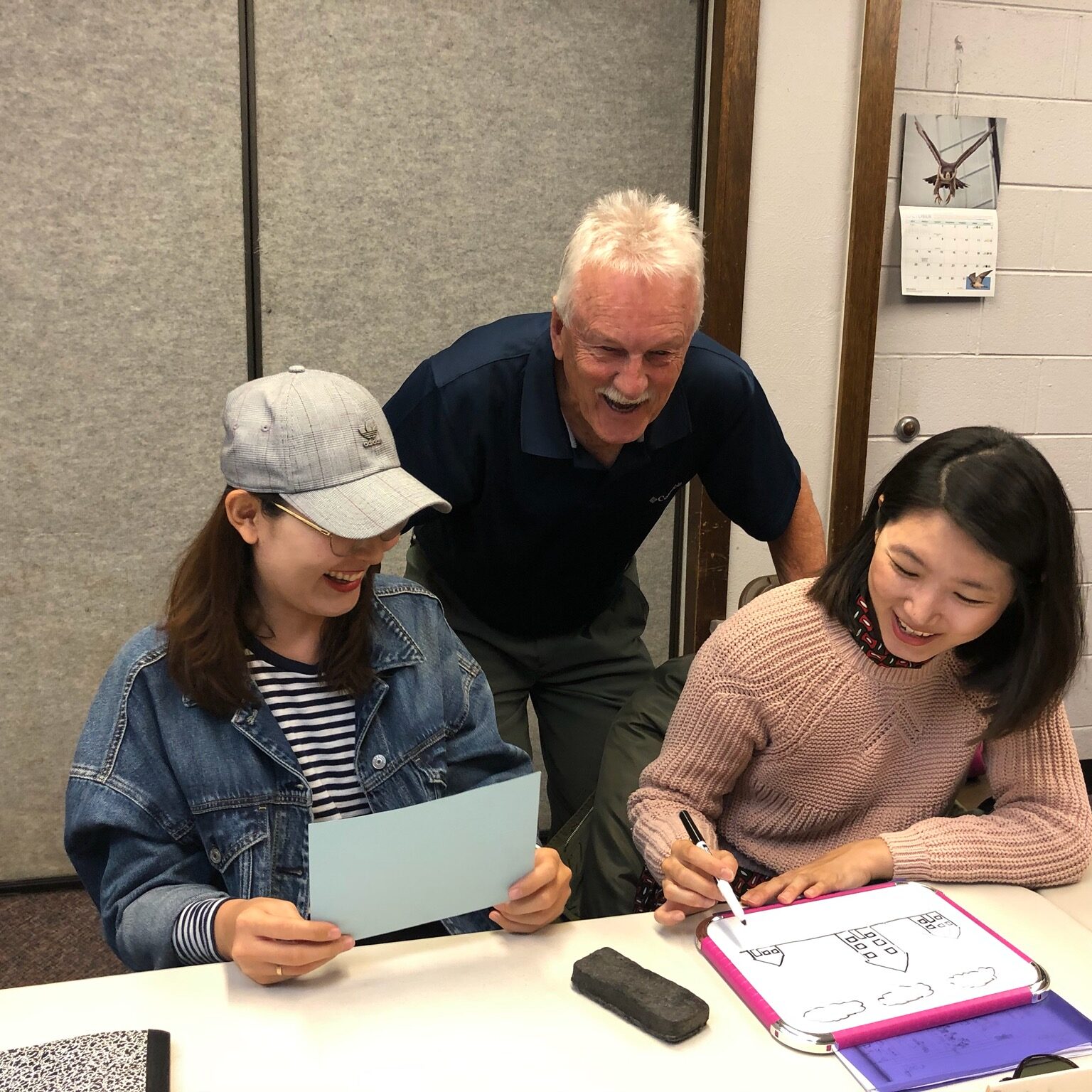 Man two students teaching